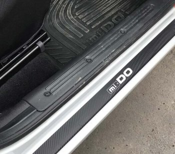 2 599 р. Пороги накладки Russtal  Datsun mi-DO (2014-2024) (Нержавейка с покрытием карбон и надписью). Увеличить фотографию 1