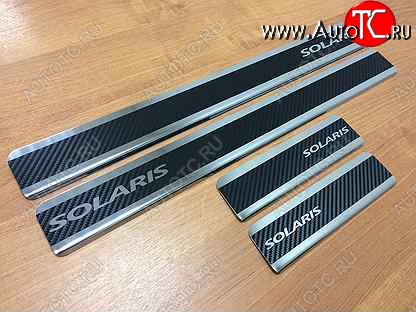 2 599 р. Пороги накладки Russtal  Hyundai Solaris  2 (2017-2022) (Нержавейка с покрытием карбон и надписью)