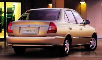 4 899 р. Задний бампер Стандартный Hyundai Accent седан ТагАЗ (2001-2012) (Неокрашенный). Увеличить фотографию 1